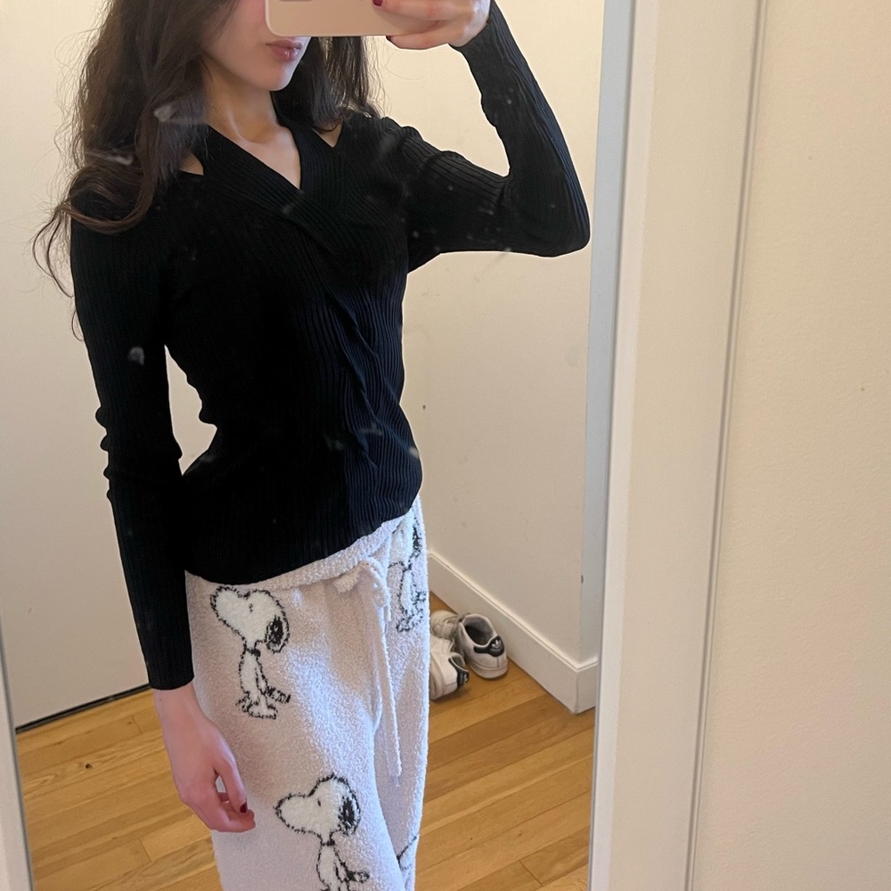 Brand new adorable knit black top w/ twisted design in the center(check 3rd pic)